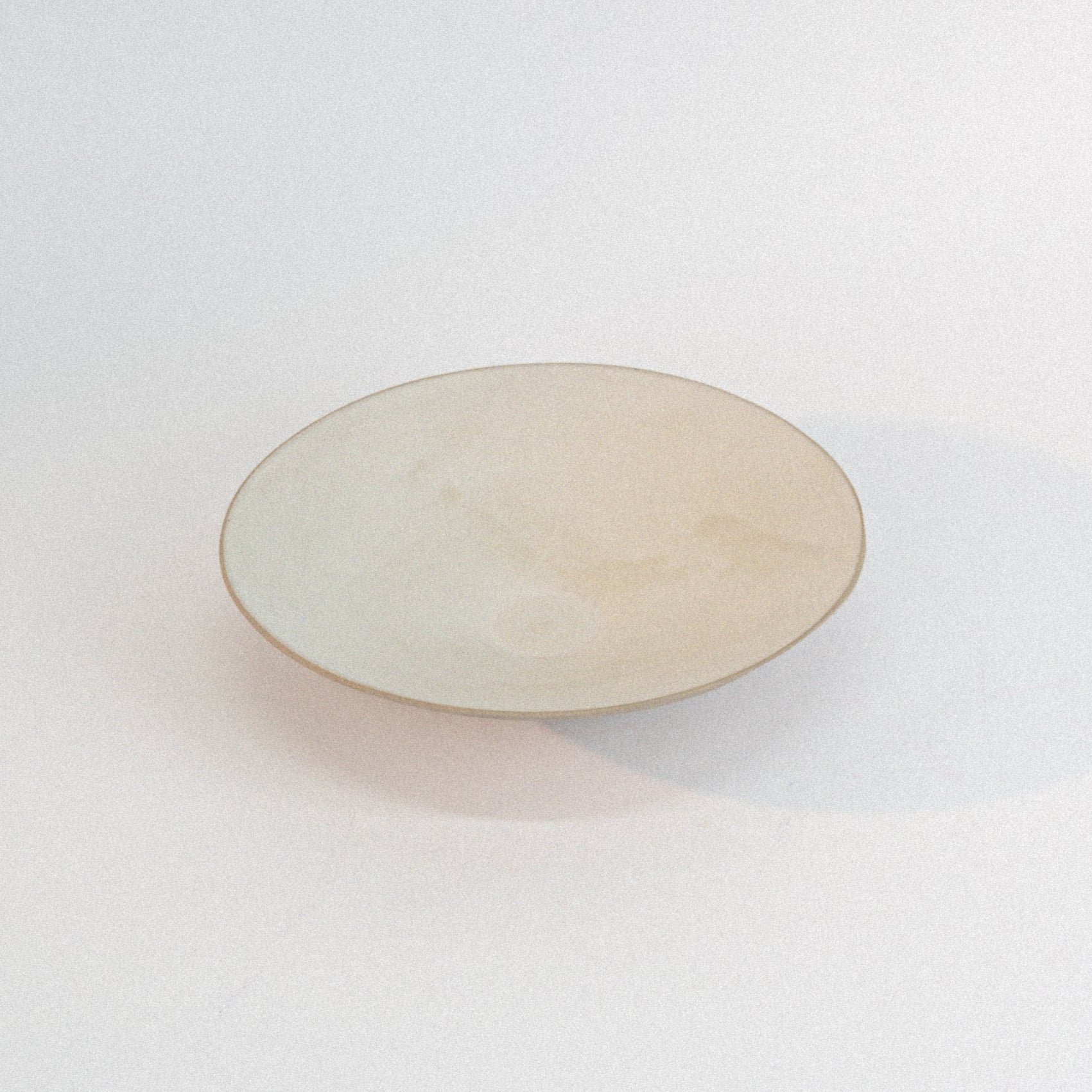 Round ceramic plate on a white background